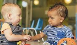 Two toddlers playing together at a Castle Rock daycare
